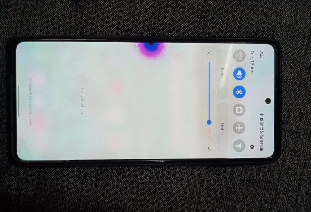 pink and blue colour spot appearing on a smartphone screen